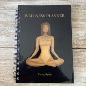 A women wellness planner featuring a minimalist design with blank monthly pages.